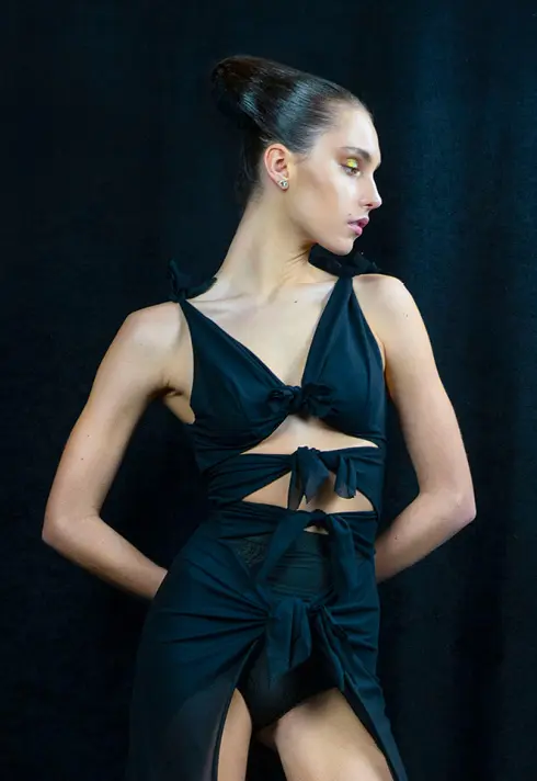 Model Genevieve Oxtoby wearing a cropped dress, in green eyeshadows. Hair style created by runway hairstylist Sam Groeneveld.
