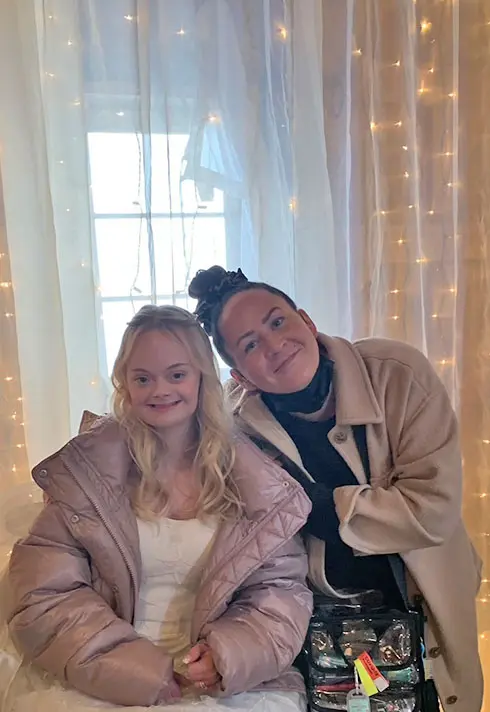 Kara Alaric with actress, Lily D Moore besides the window
