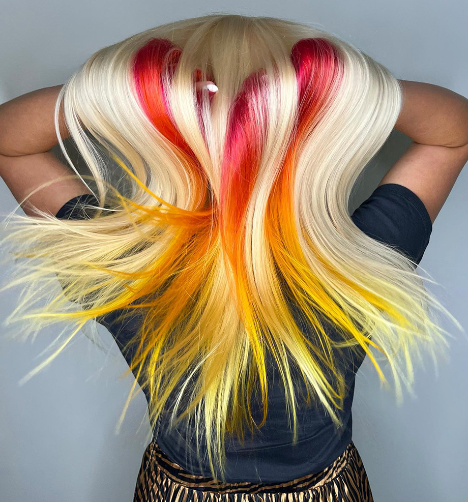 Blonde hair with striking red, orange and yellow stripes