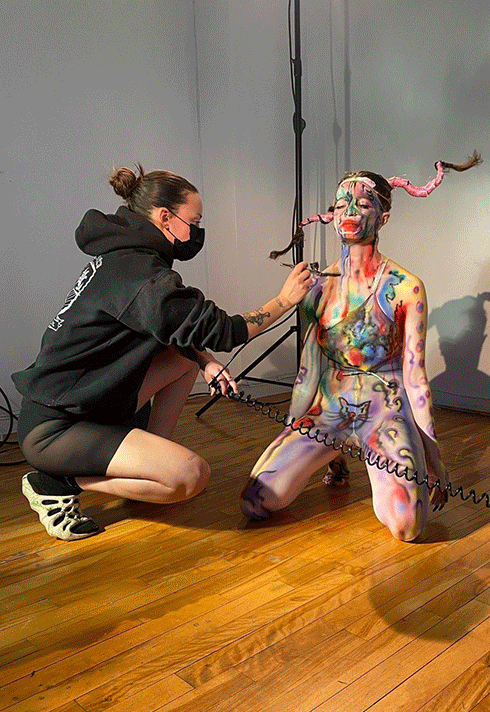 Blanche Makeup School grade, Carole Méthot, working on body makeup with a female model.