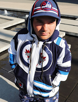 A close up shot of Linden Porco wearing a customized jacket designed by Tyson Gibson