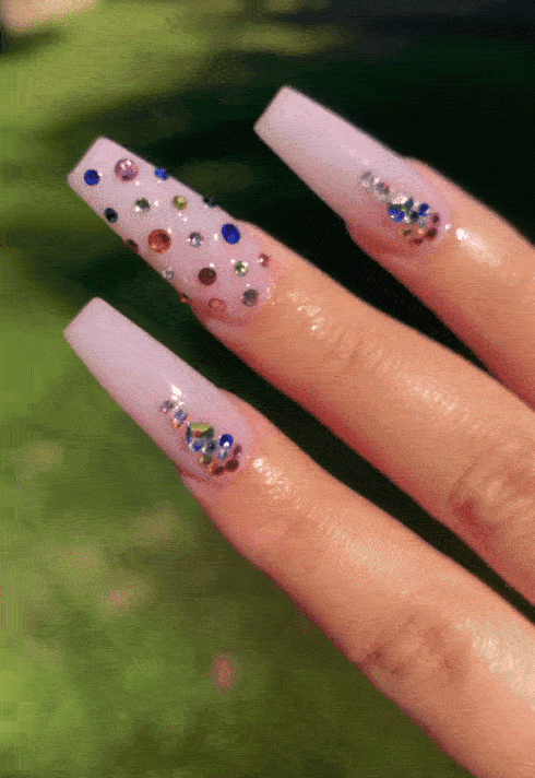 Pink coffin nail design with crystals by nail tech Hailey