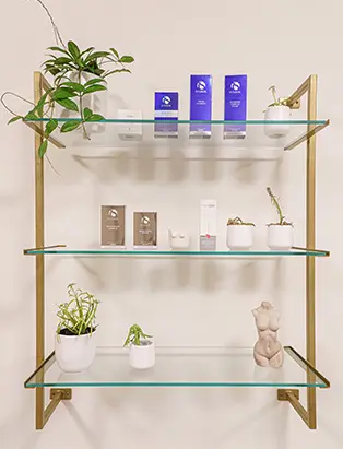 Product shots of skincare on a golden shelf