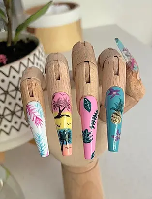 A wooden hand manique with summery nail design in a long coffin shape