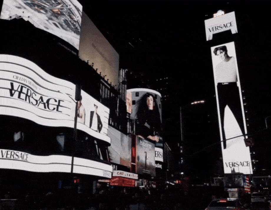 Anne Hathaway and Cillian Murphy​ Versace Campaign playing in Time Square, New Yorlk