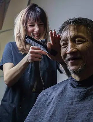 2 Paycheques Away.. Is Uplifting Spirits and Fostering Community Through Barbering
