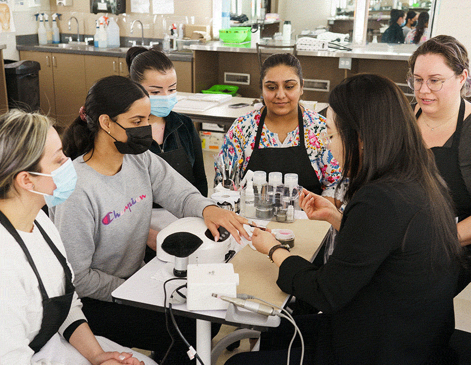 Hailey Lee teaching classes for nail tech, and showing different nail techniques to students