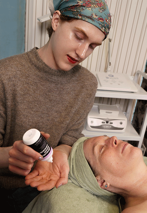 Facial serum massage during a professional skincare treatment in Vancouver